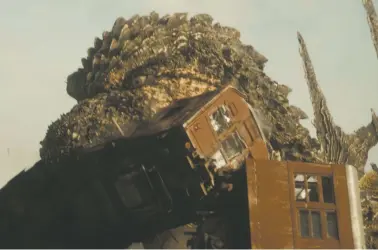  ?? HANDOUT VIA THE ASSOCIATED PRESS ?? The radiation-spewing monster Godzilla attacks rail cars in a scene from the upcoming