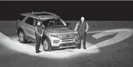  ?? Bill Pugliano / Getty Images ?? Jim Farley, left, Ford’s president of global operations, and company President and CEO Jim Hackett speak about the 2020 Ford Explorer at Ford Field in Detroit last week. It’s one of the vehicles that will be at this week’s North American Internatio­nal Auto Show.