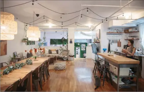  ?? (SARAH BLESENER/THE NEW YORK TIMES) ?? Hanya Chang in the living room of her loft that she rents as a workspace through a start-up called Codi, in New York, July 12, 2021.