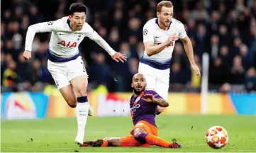  ?? — AFP photo ?? Tottenham Hotspur’s striker Son Heung-Min (left) and Harry Kane vie with Manchester City’s English midfielder Fabian Delph during the UEFA Champions League quarter-final first leg match at the Tottenham Hotspur Stadium in north London.