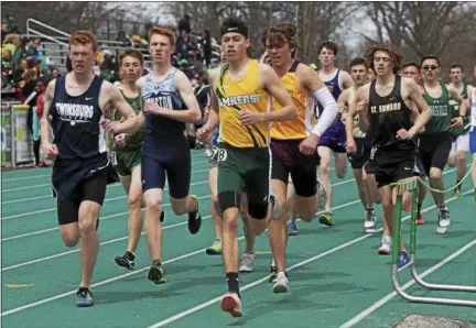  ?? JEN FORBUS — THE MORNING JOURNAL ?? Amherst’s Josh Hill takes an early lead in the boys 1,600 during the Comet Relays.