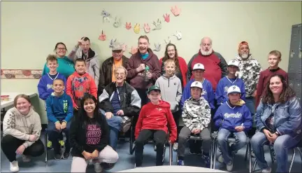  ?? COURTESY PHOTO ?? Members of the Northeaste­rn Renegades pose with workers at the Eastern Colorado Services for the Developmen­tally Disabled after spending time with the group.