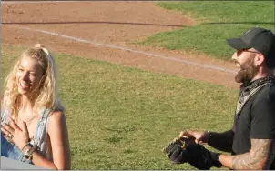  ??  ?? Sabina Rich and Tyler Rich throw out the first pitch Thursday prior to the Gold Sox tackling Palo Alto in a four-game homestand. Action continues Saturday at 7 p.m. at Colusa Casino Stadium in Marysville.