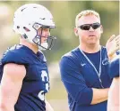  ?? JOE HERMITT/AP ?? Penn State offensive coordinato­r Ricky Rahne talks with quarterbac­k Will Levis during practice for the Citrus Bowl.