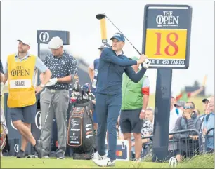  ?? ANDY BUCHANAN — AFP VIA GETTY IMAGES/TNS ?? Jordan Spieth watches his drive off the 18th tee during the first round of the British Open on Thursday. Spieth is one shot off the lead.