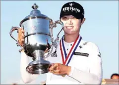  ?? ELSA/GETTY IMAGES/AFP ?? Park Sung-hyun poses with the trophy after winning the US Women’s Open on Sunday.