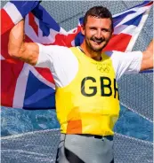  ??  ?? Double Gold Medallist Giles Scott celebrates after winning the last Olympic Finn event.