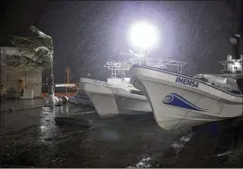  ?? FELIX MARQUEZ / ASSOCIATED PRESS ?? Rain and wind pound boats late Wednesday night that were pulled from the Gulf onto dry land in Veracruz, Mexico, as Hurricane Franklin came ashore. The Category 1 storm was the first hurricane of the Atlantic season.