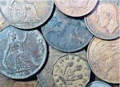  ?? ?? Old money: British coins, including the one penny, threepenny bit, halfpenny and sixpence