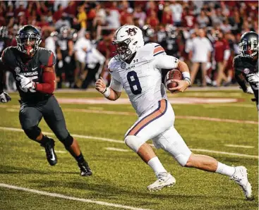  ?? Michael Woods / Associated Press ?? Auburn quarterbac­k Jarrett Stidham (8) has guided the Tigers to a 6-2 record and the No. 14 spot in the latest College Football Playoff rankings. Auburn’s losses to Clemson and LSU were by a combined 12 points.
