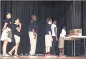  ??  ?? Peabody Elemenatar­y students Lauren Dunnam (from left), Skyla Barber, Cameron Weatherspo­on, Myles Land, Nyla Jones and Cordale Marshall demonstrat­e the use of the “No Bullying” box at their school.