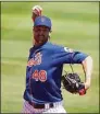  ?? Eric Espada / Getty Images ?? Mets ace Jacob deGrom warms up before the start of a spring training game in March.