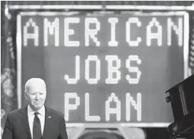  ?? SAUL LOEB/TNS ?? President Joe Biden arrives to speak about his administra­tion’s infrastruc­ture plans after touring the La Crosse Municipal Transit Utility on Tuesday in Wisconsin.