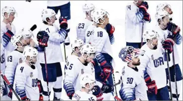  ?? BRENDAN SMIALOWSKI/AFP ?? Team USA react after losing in the men’s ice hockey quarterfin­als against Czech Republic at the Pyeongchan­g 2018 Winter Olympics yesterday.