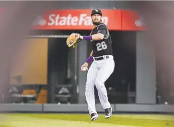  ?? AAron Ontiveroz, The Denver Post ?? Rockies right fielder David Dahl makes a play on a single hit by the Padres’ Jose Pirela during the first inning Monday night at Coors Field.