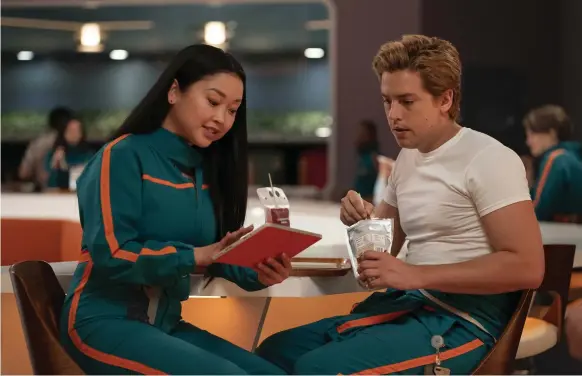  ?? Warner Bros Pictures ?? Sophie, played by Lana Condor, left, and Walt, played by Cole Sprouse, grow close during a journey from Earth to Mars in ‘Moonshot’