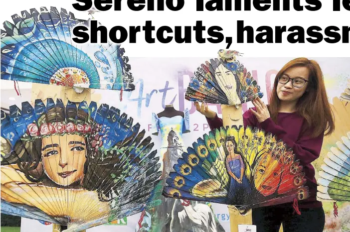  ?? MIGUEL DE GUZMAN ?? A woman arranges fans or abanico with handpainte­d images depicting Mother Nature during the Rizal ARTBanico competitio­n at SM Masinag in Antipolo, Rizal as part of the celebratio­n of Internatio­nal Women’s Month of March. Today is Internatio­nal Women’s...