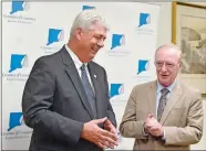  ?? TIM MARTIN/THE DAY ?? Tony Sheridan, right, president and CEO of the Chamber of Commerce of Eastern Connecticu­t, looks on after announcing Bill Stanley, left, vice president of developmen­t and community relations for Lawrence + Memorial Hospital/Yale New Haven Health, is...