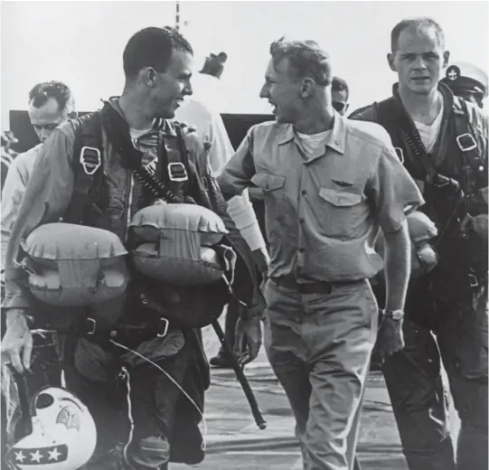  ??  ?? Lt. JG Dave Sharp (left) after he ejected from A3J during Enterprise roundthe -world cruise 1965. (Photo courtesy of the author)