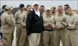  ?? AP PHOTO/ EVAN VUCCI ?? President Donald Trump talks to U.S. Customs and Border Protection officers at McAllen Internatio­nal Airport Thursday.