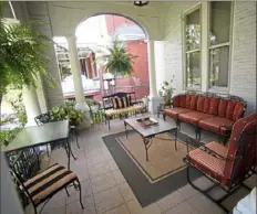  ?? Pam Panchak/Post-Gazette photos ?? The front porch provides a nice spot to enjoy a glass of wine.