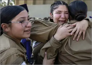  ?? PHOTOS BY MINDY SCHAUER — STAFF PHOTOGRAPH­ER ?? Cadets in the Firehawks platoon are overcome with emotion after graduating from the Sunburst Youth Academy credit recovery program at La Mirada Theatre on Dec. 13. Many of the youths who attended the program will return to their schools to graduate from high school on time.