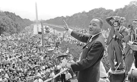  ?? AFP ?? ■ Civil rights leader Martin Luther King waves to supporters during the ‘ March on Washington’ on the Mall in Washington, DC, in 1963. Towards the end of his life, Martin Luther King Jr. lamented that his dream had ‘ turned into a nightmare.’