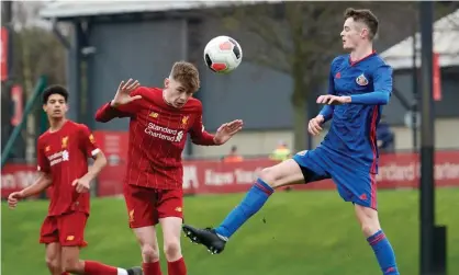  ??  ?? Joe Hugill (right) competes with Conor Bradley of Liverpool during an U18 Premier League game in January. Photograph: Nick Taylor/ Liverpool FC via Getty Images