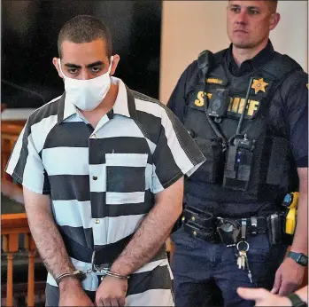  ?? ?? IN CUSTODY: Matar in court last night and, left, being led from the scene of the attack