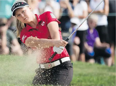  ?? PHOTOS: JONATHAN HAYWARD/CANADIAN PRESS ?? Brooke Henderson is tied for second heading into the third round of the CP Women’s Open in Regina.