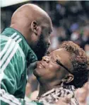  ?? ELSA/GETTY ?? Shaquille O’Neal hugs his mother, Lucille O’Neal, before a 2011 NBA playoff game in Boston. Lucille O’Neal has been named godmother of the transforme­d Carnival Radiance.
