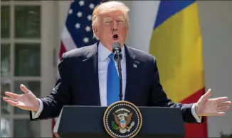  ?? The Associated Press ?? U.S. President Donald Trump speaks during a news conference with Romanian President Klaus Werner Iohannis in the Rose Garden at the White House on Friday.