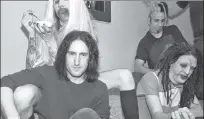  ??  ?? AMERICAN GOTHIC: Manson (pictured in 1995 in a blond wig) rose to fame partly thanks to Nine Inch Nails frontman Trent Reznor (center), who produced Manson’s 1994 debut album. Reznor later distanced himself from Manson, calling him ”toxic” in 2005.