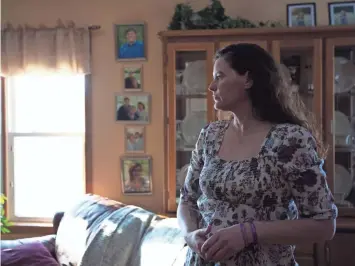  ?? ALEXANDRA WIMLEY/USA TODAY NETWORK-WISCONSIN ?? Missy Ojibway stands in her home Jan. 26 in Jim Falls. Her daughter Megan died by suicide in May 2016. Since then she routinely receives calls from other parents desperate for guidance. “I can’t go out to dinner with my other half without somebody...