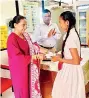  ?? ?? SLFUW President Col Dr Udula Krishnarat­ne with a student