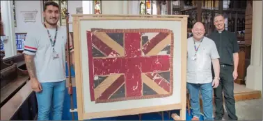  ?? ?? HISTORIC: Joinery lecturers Dom Horn and Stephen Seymour, and Father Stephen Race at St Mary’s Church unveiling the framed flags.