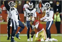  ?? KARL MONDON STAFF ?? San Francisco quarterbac­k Jimmy Garoppolo faces Aaron Donald and a tough Rams defense today. And the 49ers have already given up 18 sacks this season.