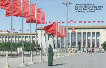  ?? Chinese flags flutter at Tiananmen Square ahead of the Belt and Road Forum in Beijing on Saturday. — Reuters ??