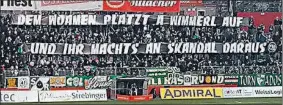  ??  ?? Auf diesem Plakat machen sich die Rapid-Fans über Austrias Holzhauser lustig. Der Klub distanzier­t sich. Heute entscheide­t die Liga über eine Strafe nach den Derby-Vorfällen.