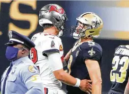  ?? Dirk Shadd / Tampa Bay Times ?? Drew Brees, right, and the Saints have a pair of decisive wins this season over Tom Brady and the Bucs, who are coming off their first playoff win in 18 years.