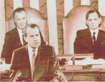  ?? SUN-TIMES LIBRARY ?? President Nixon delivers the State of the Union address on Jan. 22, 1971, as Vice President Spiro Agnew (left) and House Speaker Carl Albert, D-Okla., look on.