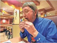  ?? USA TODAY NETWORK-WISCONSIN ?? Fond du Lac resident Don Gorske takes a bite of his 29,000th Big Mac on Thursday.