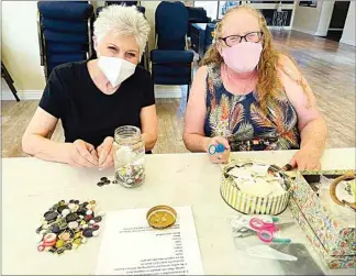  ?? COURTESY OF CHABAD OF BAKERSFIEL­D ?? Volunteers sort buttons at Chabad of Bakersfiel­d Jewish Community Center for the Central Valley Holocaust Button Memorial. Help is still needed to sort the 6 million buttons that will be included in the display.