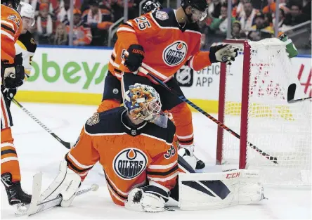  ?? DAVID BLOOM ?? Edmonton Oilers goaltender Cam Talbot was at his best early and stopped 27 of 29 shots in backstoppi­ng the Oilers to a 3-2 overtime win over the Boston Bruins in the home opener at Rogers Place on Thursday.