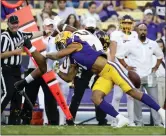  ?? ASSOCIATED PRESS FILE PHOTO ?? LSU cornerback Derek Stingley Jr. (7) forces a fumble by Central Michigan running back Darius Bracy (2) during a game in Baton Rouge, La., Sept. 18. Stingley was selected by the Houston Texas with the third pick in the NFL draft Thursday.