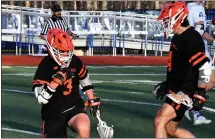  ?? DREW ELLIS — FOR MEDIANEWS GROUP ?? Birmingham Brother Rice’s Peter Biglin, left, celebrates a goal with teammate Caiden Ramos during the first half of Tuesday’s lacrosse match with Novi Detroit Catholic Central. The Warriors prevailed, 16-10.