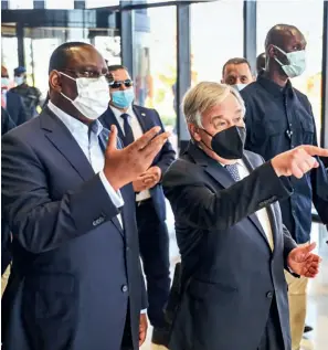  ?? ?? UN Secretary General Antonio Guteres (centre) and Senegalese President Macky Sall (left) visit the constructi­on site of the House of UNO in Diamniadio, Senegal, in May 2022