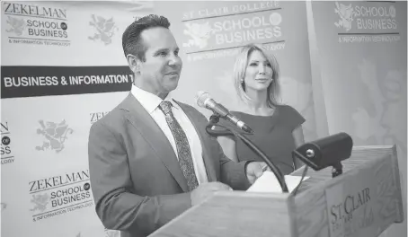 ?? PHOTOS: DAX MELMER ?? Barry Zekelman, with his wife Stephanie, addresses a news conference Wednesday for the naming of the St. Clair College Zekelman School of Business and Informatio­n Technology in downtown Windsor.