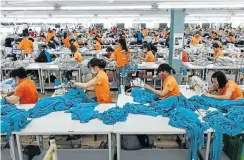  ?? Picture: SeongJoon Cho/Bloomberg via Getty Images ?? Vietnam is fast becoming a major beneficiar­y of US President Donald Trump’s trade war as manufactur­ing jobs leave China.