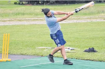  ?? JASON SIMMONDS • THE GUARDIAN ?? Kamal Rinwa follows through after connecting with the ball at Three Oaks Senior High School in Summerside on July 6. The 10-team IO Solutions provincial cricket tournament will take place at the Three Oaks pitch on July 10-11.